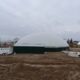 Digester installed by DLS Biogas with a low temperature pasteurizer and liquid receiving pit pictured